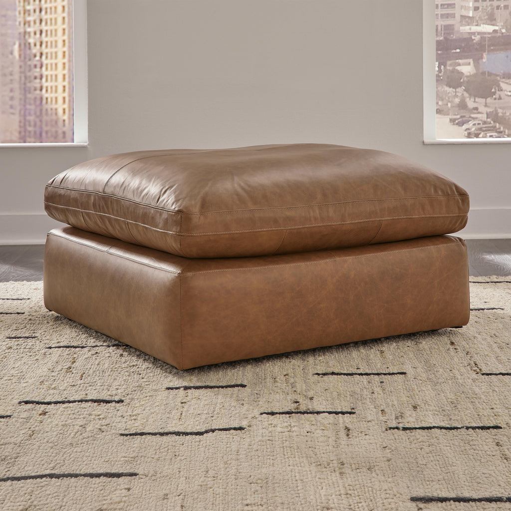 Emilia Caramel ottoman in a living room
