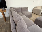 Five-piece modular sectional with matching ottoman in the showroom