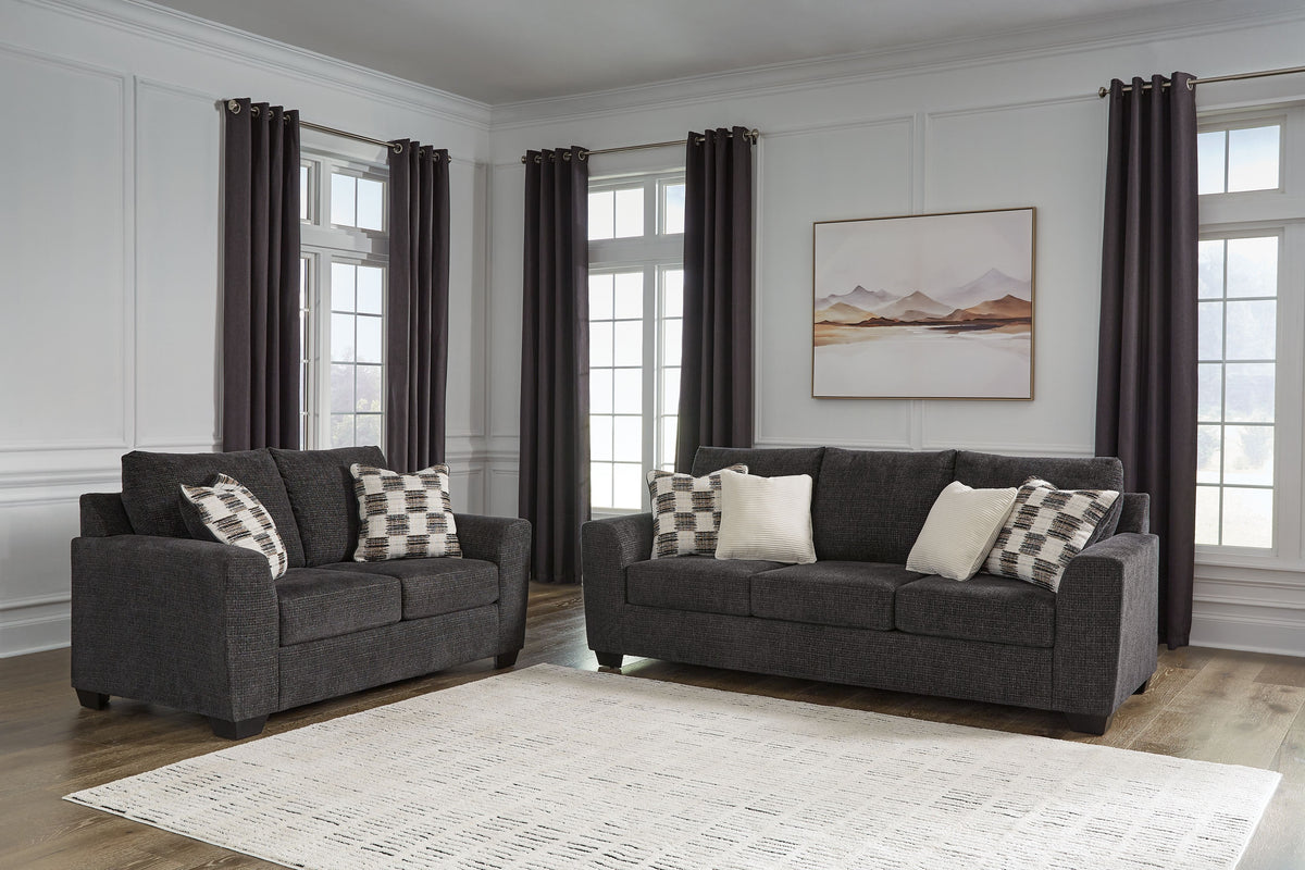 Loreo sofa in Ebony shown with matching loveseat